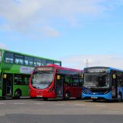 The blue X20 Essex Airlink bus among other buses