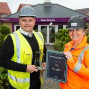Stuart Jones receives the regional prize in the Bellway Health and Safety Awards from group health and safety director, Claire Birkhead