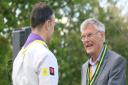 Neville Wilson receives the Silver Wolf, the Scouting movement's highest honour, from District Commissioner Nigel Bailey in Great Chesterford