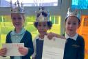 Students at The Flitch Green Academy, Little Dunmow, with a letter from Windsor Castle