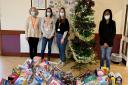 Home-Start Essex with Saffron Walden constituency MP Kemi Badenoch and the toys donated for the Christmas appeal