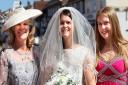 Farleigh Hospice charity shop in Great Dunmow is focussed on wedding and prom related items. Debbie de Boltz in a Mother of the bride dress £20, hat £6.50. Caroline Smith in a Bride's dress £200 (new with tags). Mia Smith in a Bridesmaid dress £20.