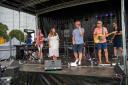 Xstatic performing on stage at Great Dunmow Summer Solstice