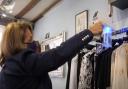 A video still showing Nikki Anthony of Wardrobe boutique in Great Dunmow, sanitising clothes