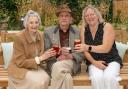 Stane House homeowners enjoy a drink at their summer party