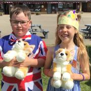 Great Dunmow Primary School students with two Corgi dogs the students were asked to name