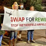 Archive image: Stop Wethersfield Airfield Prisons protestors show off their banner at Braintree District Council