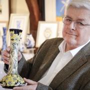 Moorcroft Chairman Hugh Edwards with his favourite new piece of Moorcroft Pottery created to celebrate the 150th anniversary of the birth of William Moorcroft, pictured at the Guildhall, Thaxted