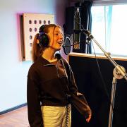 A member of Sirius Young Performers, Chloe Dean recording her song called The Barn.