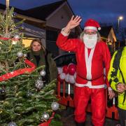 Santa Claus and Revd Dr Colin Fairweather wish residents a merry Christmas