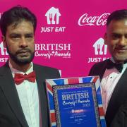 Halal Mah and Zia Chowdhury collect their shortlisted certificate for Jalsa Ghar, Great Dunmow, at the British Curry Awards 2021