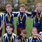 Great Dunmow Primary School's Year 6 tag rugby team show off their medals.