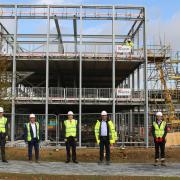 In front of the steel frame at the new Great Notley Enterprise Centre: Cllr Tom Cunningham (Deputy Leader, Braintree District Council), Adam Bryan (CEO, South East LEP), Ian Gifford (Operations Director, Kier), Cllr Kevin Bowers (Cabinet Member for