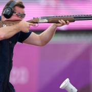 Great Britain's Matthew Coward-Holley in action during the men's trap final at Asaka Shooting Range