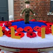The knitted Post Box topper showing 100 years of the RBL in Great Dunmow