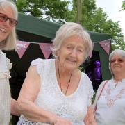 Florence Manly of Felsted (centre) cuts her 105th birthday cake