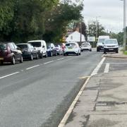 The row of cars blocking the road in Takeley