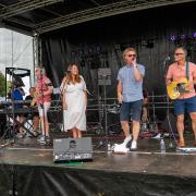 Xstatic performing on stage at Great Dunmow Summer Solstice