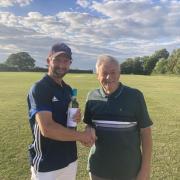 Graham Milbank receives his man of the match award from president Brian Hockley. Picture:  ARCC