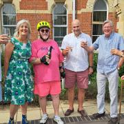 Cllr Geof Driscoll celebrates the completion of his cycling challenge