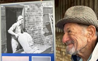 Shlomo Manns, a former refugee at Bachad Farm Institute in Thaxted, looking at a picture of his younger self