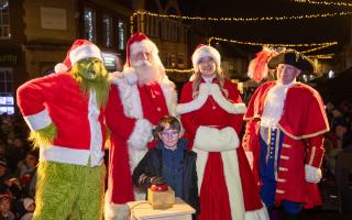 George Muscrost, nine, switching on the Dunmow Christmas lights